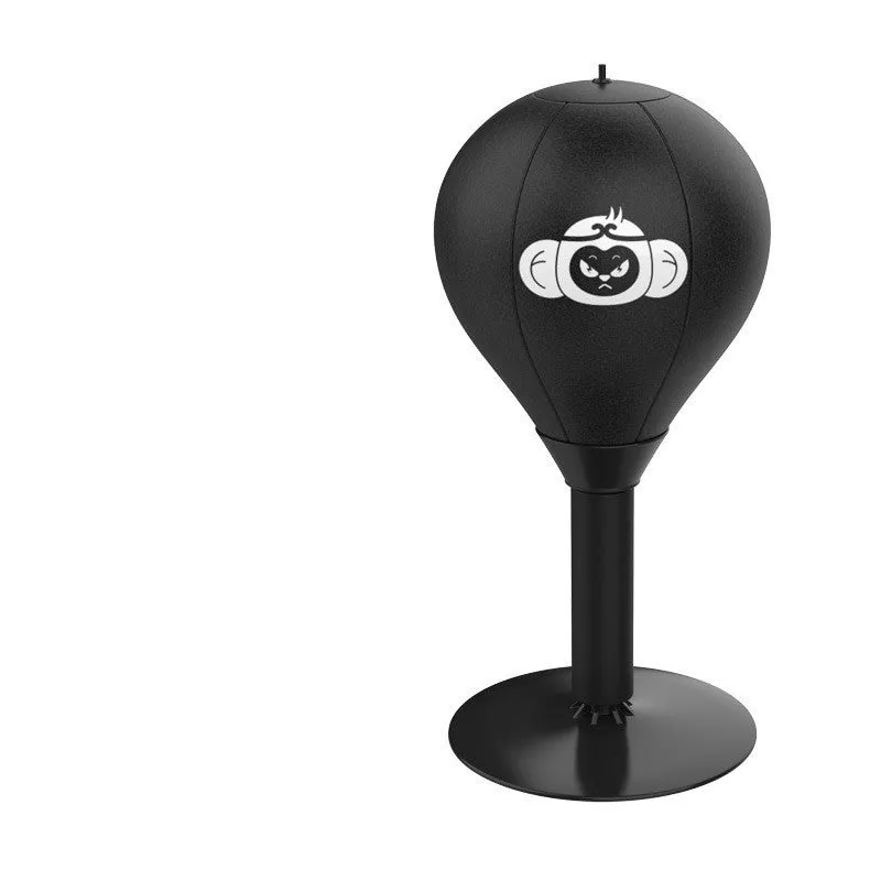 Tabletop boxing speed ball with suction cup base on a desk, showing burst bear design and flexible connection tube