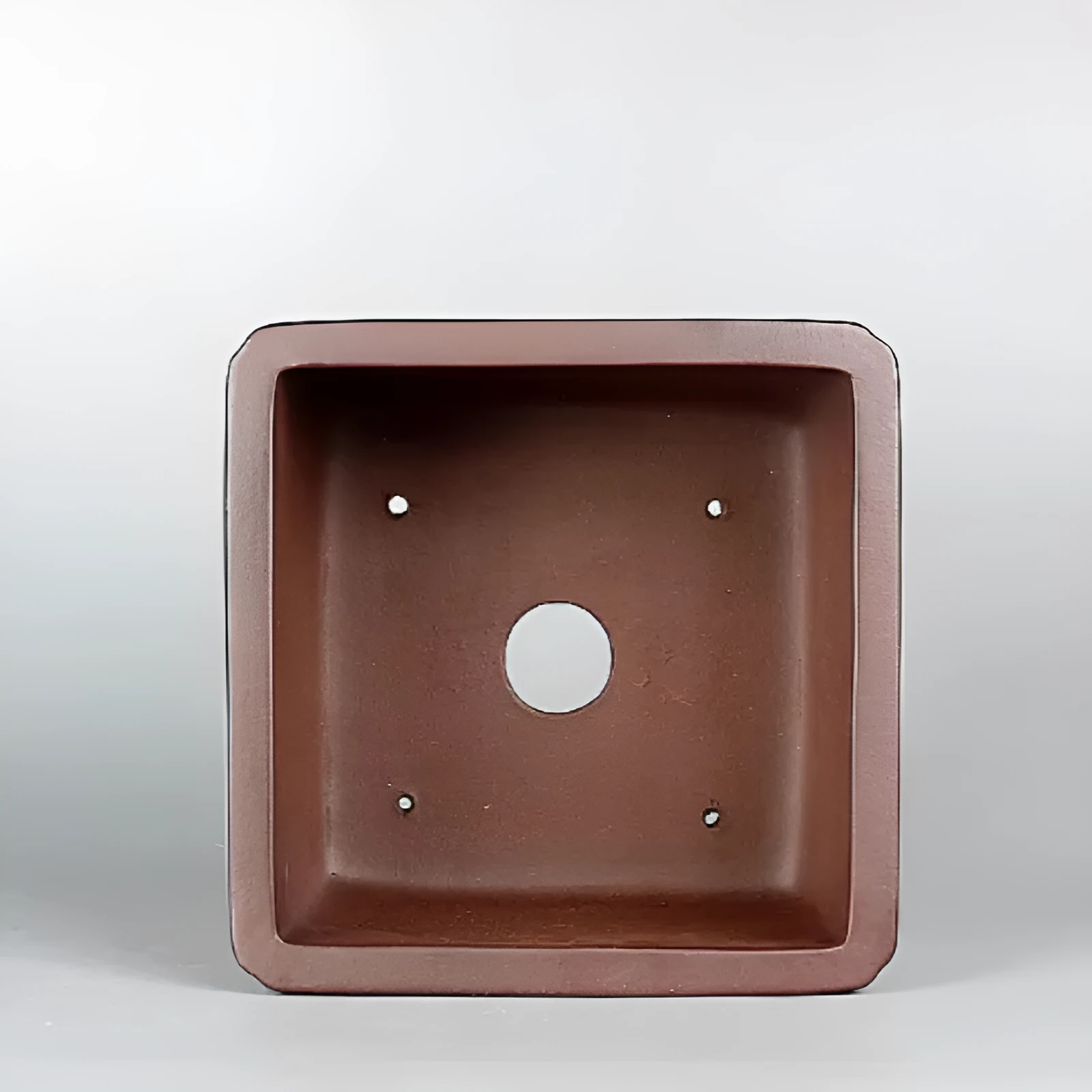 Brown handmade purple clay flower pot with antique finish.