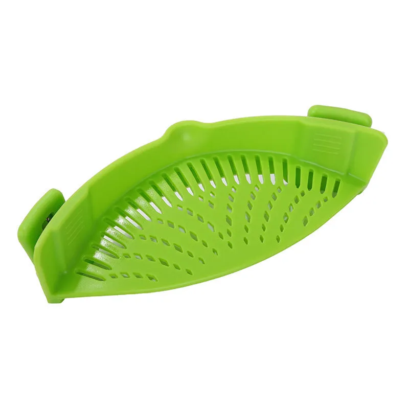Silicone clip-on kitchen strainer with stainless steel frame attached to pot rim for draining liquids