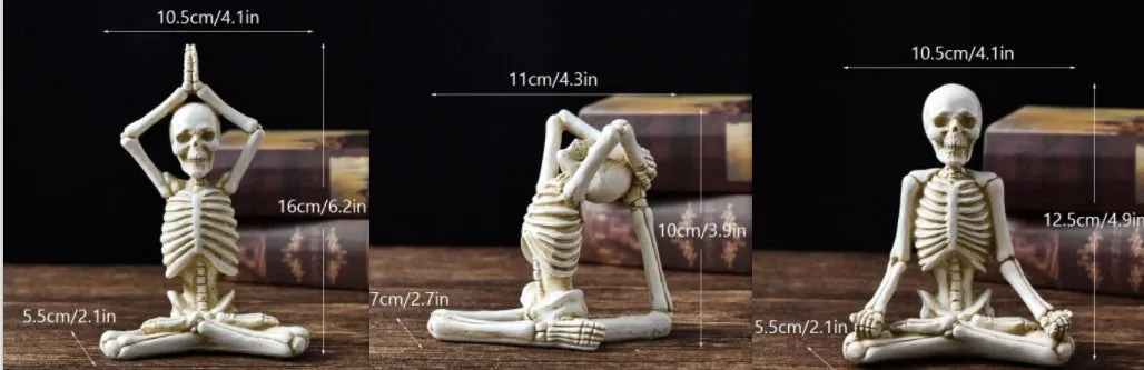 Hand-painted resin yoga pose skull skeleton ornament measuring 10.5-11cm wide on wooden desktop