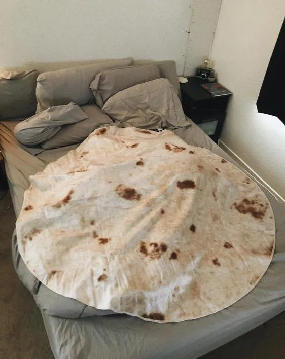 Round flannel burrito blanket with food-themed printing, shown in coral fleece fabric.