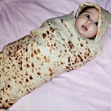 Round flannel burrito blanket with food-themed printing, shown in coral fleece fabric.