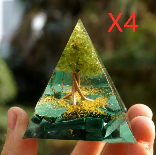 Small 6cm high clear epoxy resin pyramid ornament filled with colourful natural crystal gravel on a shelf.