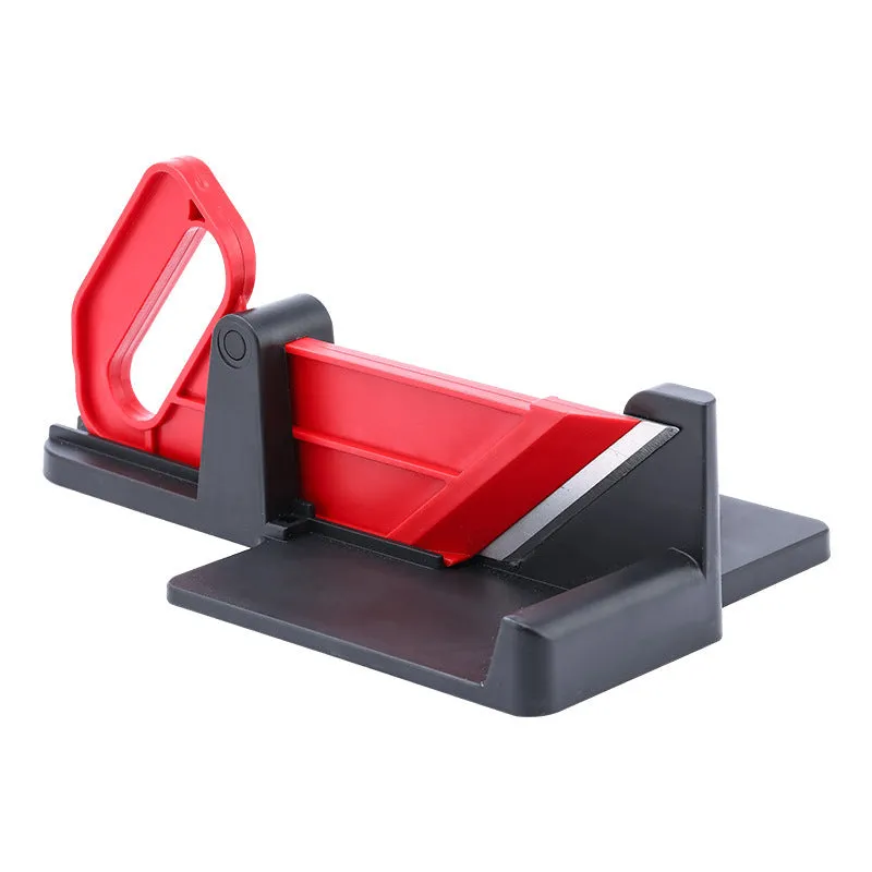 Green vegetable cutter with stainless steel blades for carrot and potato slicing in kitchen