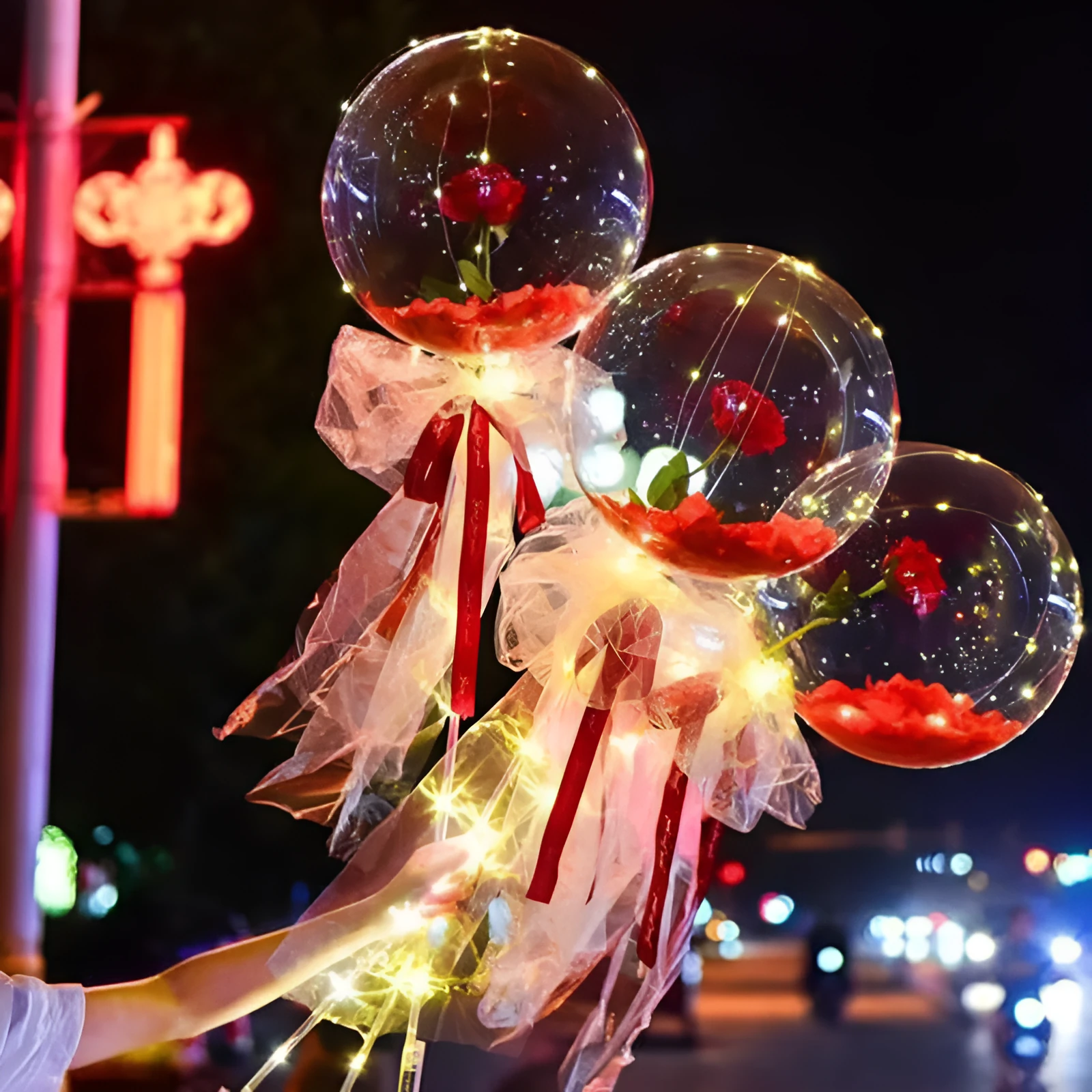 DIY LED luminous transparent balloon rose bouquet kit with artificial flowers and lights for assembly.