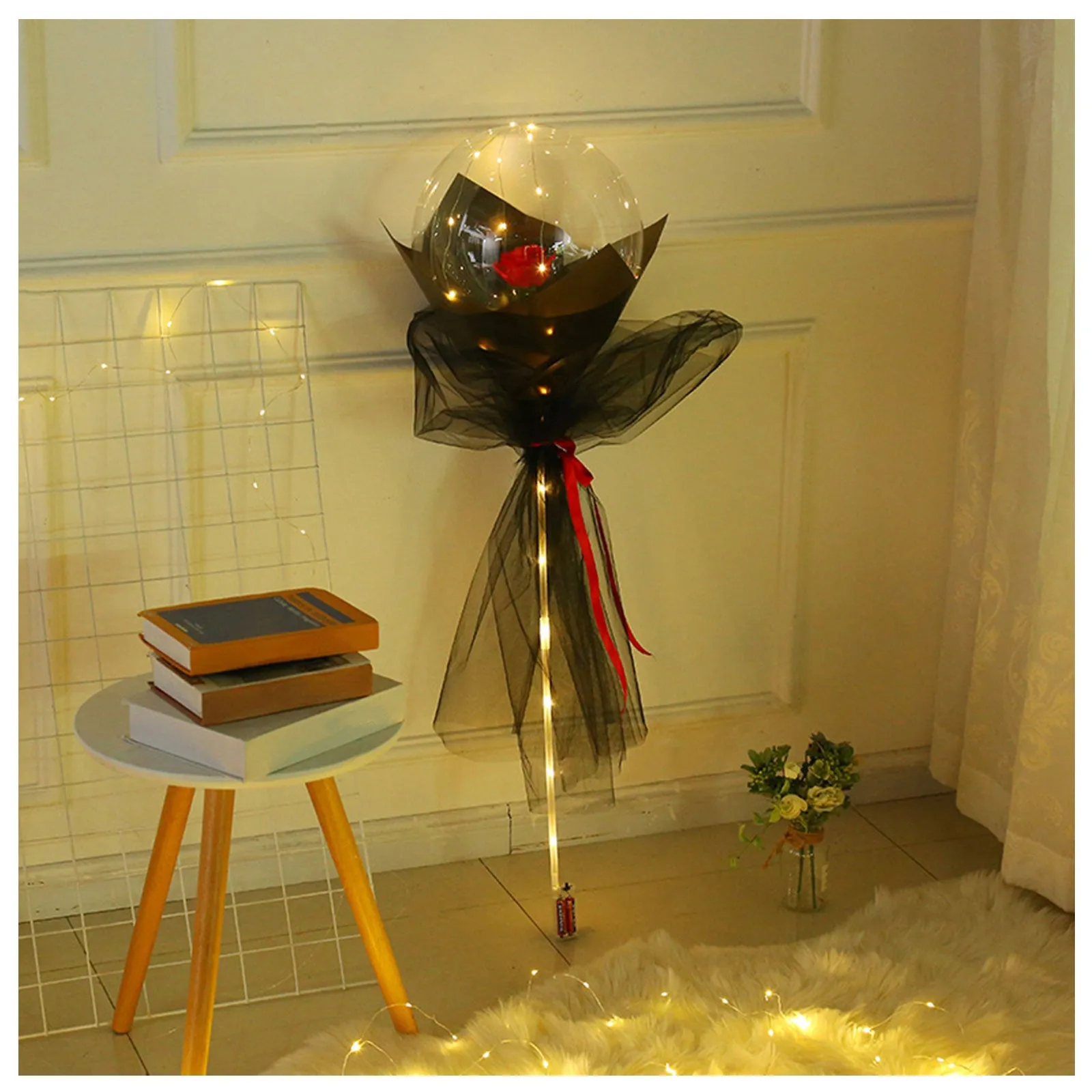 DIY LED luminous transparent balloon rose bouquet kit with artificial flowers and lights for assembly.