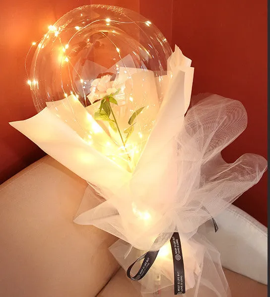 DIY LED luminous transparent balloon rose bouquet kit with artificial flowers and lights for assembly.