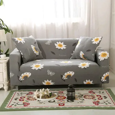 Printed geometric pattern stretch sofa slipcover fitted on a modern three-seater sofa.