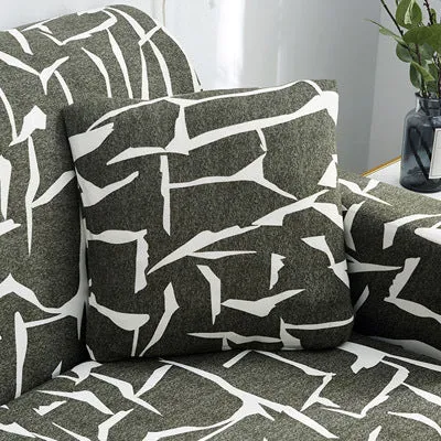 Printed geometric pattern stretch sofa slipcover fitted on a modern three-seater sofa.