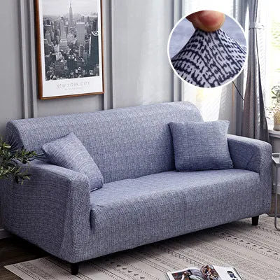 Printed geometric pattern stretch sofa slipcover fitted on a modern three-seater sofa.