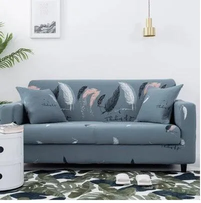 Printed geometric pattern stretch sofa slipcover fitted on a modern three-seater sofa.