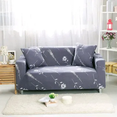 Printed geometric pattern stretch sofa slipcover fitted on a modern three-seater sofa.