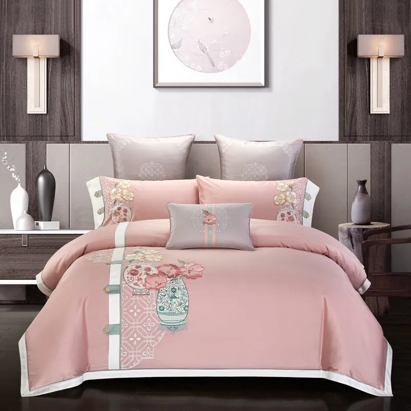 Four-piece cotton embroidery bed set showing decorative pattern on 100% cotton satin weave fabric