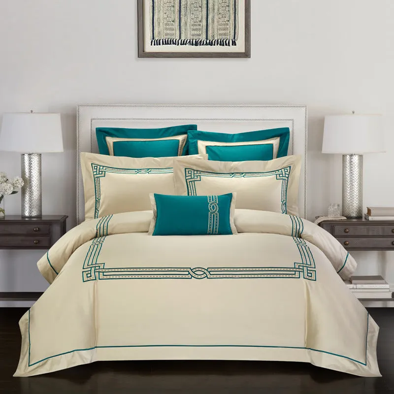 Four-piece cotton embroidery bed set showing decorative pattern on 100% cotton satin weave fabric