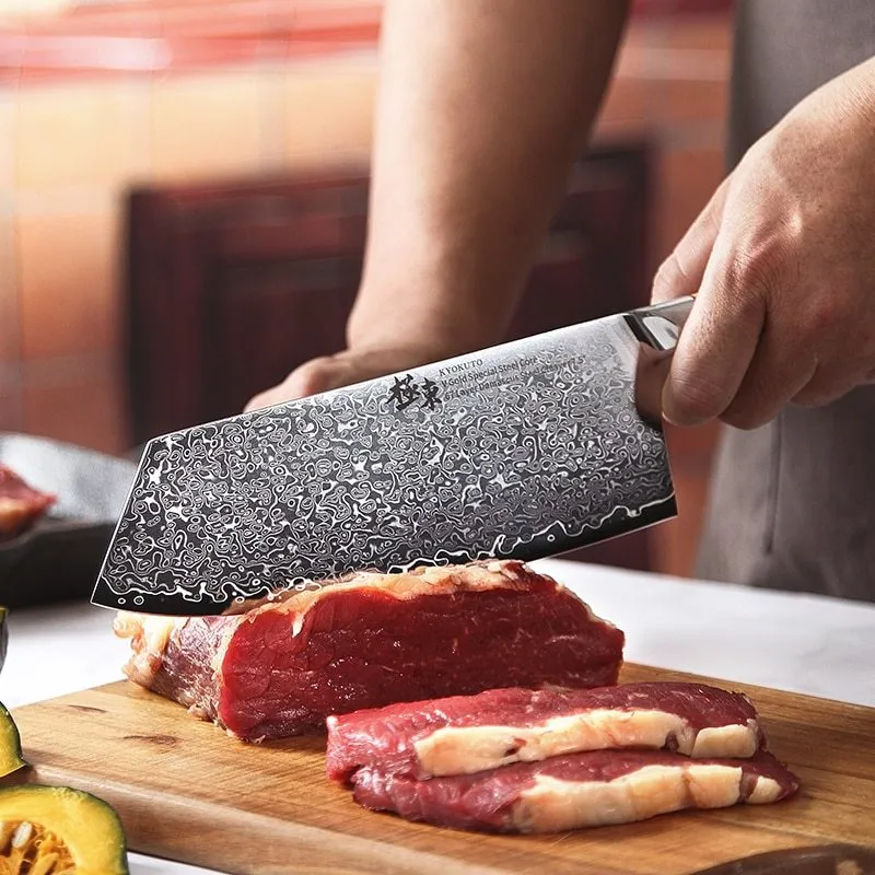 V gold Damascus kitchen knife set with 67-layer steel construction showing distinctive patterning on multiple blade sizes