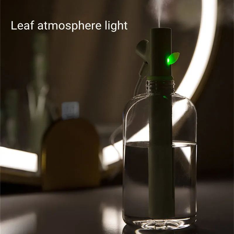 Transparent round portable USB ultrasonic cool mist humidifier on a desk