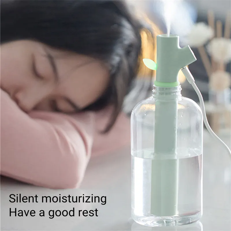 Transparent round portable USB ultrasonic cool mist humidifier on a desk