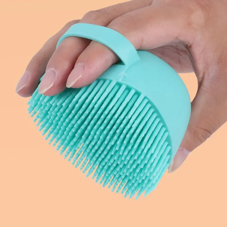 Blue silicone dog bath brush with soft bristles for washing and massage
