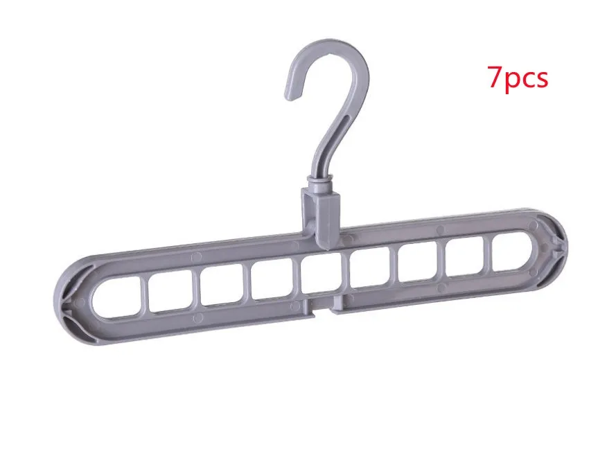 Plastic clothes hanger with a white hook on a pink background, showing its 33 cm length and rotatable handle.