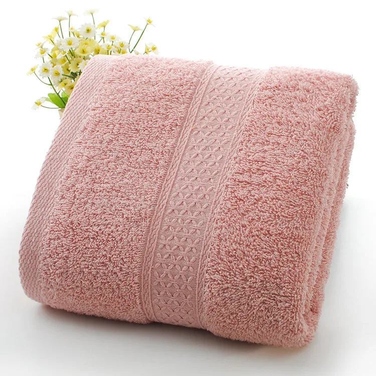 Thick bath and beach towels in seven colour options including apple green, dark blue, and light pink