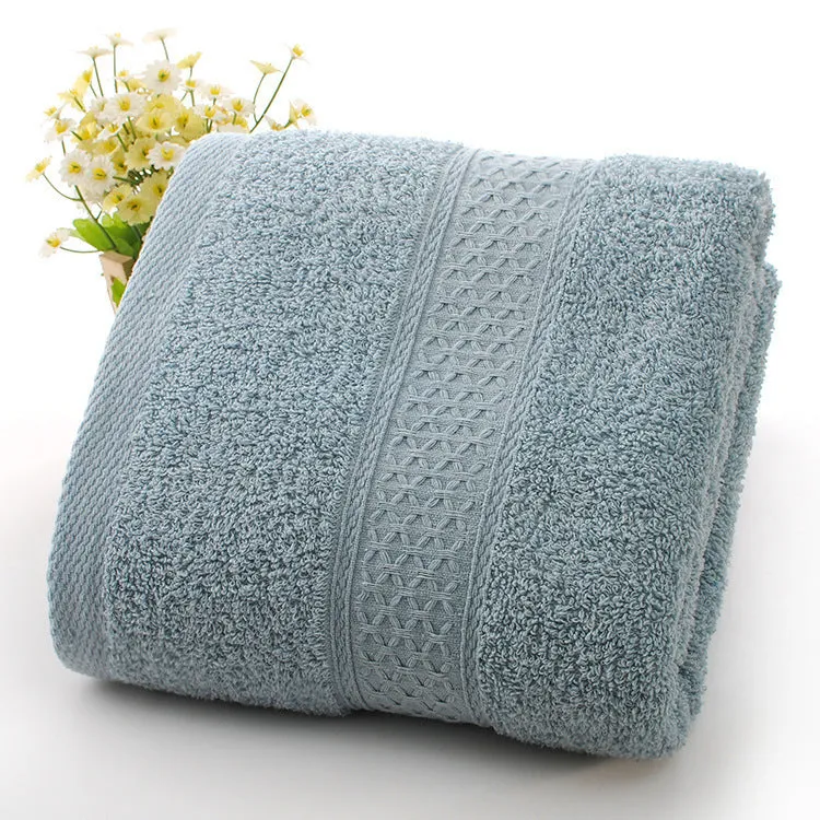 Thick bath and beach towels in seven colour options including apple green, dark blue, and light pink