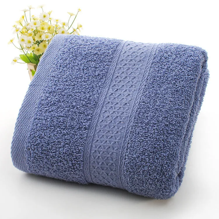 Thick bath and beach towels in seven colour options including apple green, dark blue, and light pink