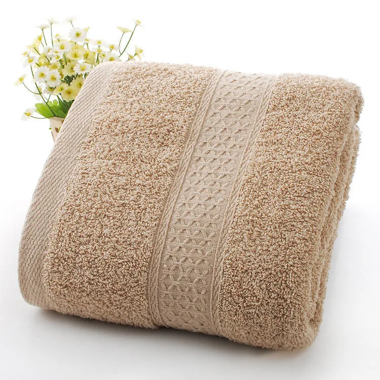 Thick bath and beach towels in seven colour options including apple green, dark blue, and light pink