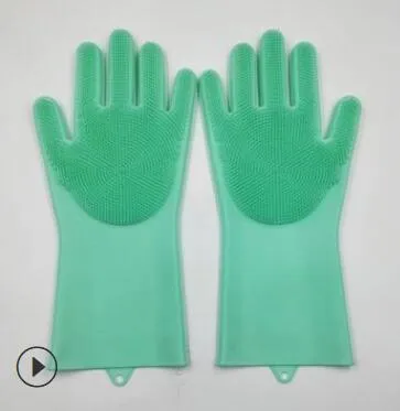 Blue silicone cleaning gloves with a textured sponge palm design for scrubbing.