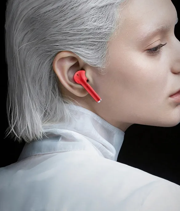 Fashion lipstick case open to show black Bluetooth earbuds with in-ear design.