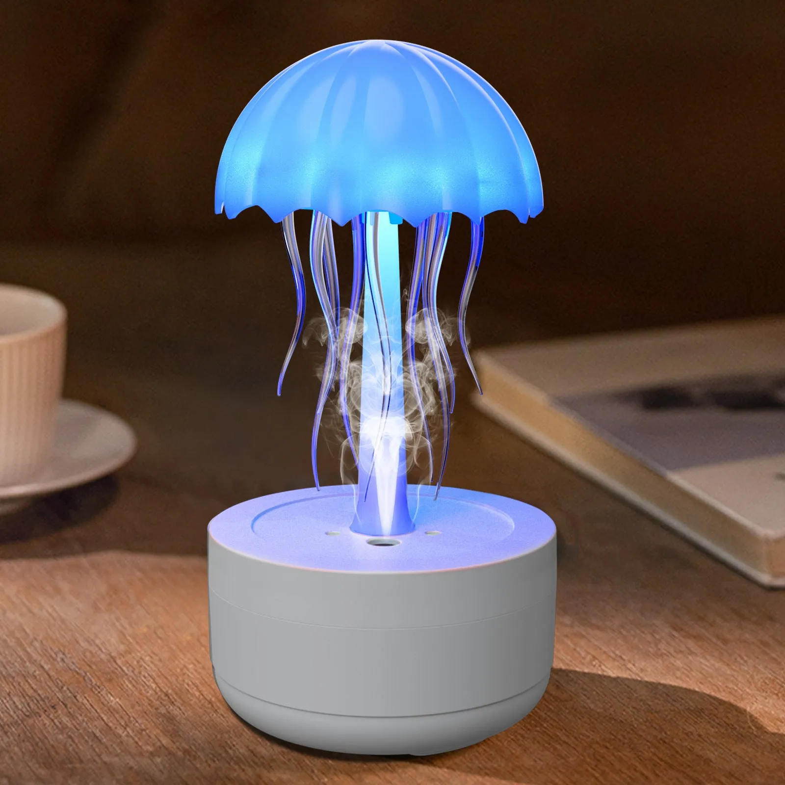 White jellyfish-shaped humidifier and essential oil diffuser with coloured LED lights and mist output.