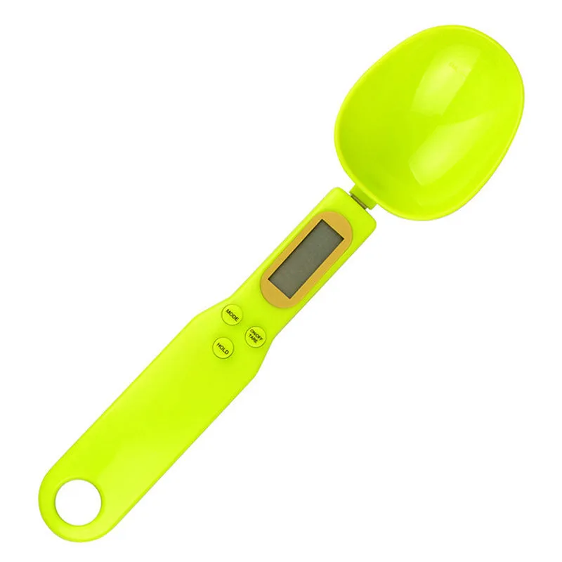 Black digital measuring spoon scale showing 0.0g display on LCD screen with 500g capacity