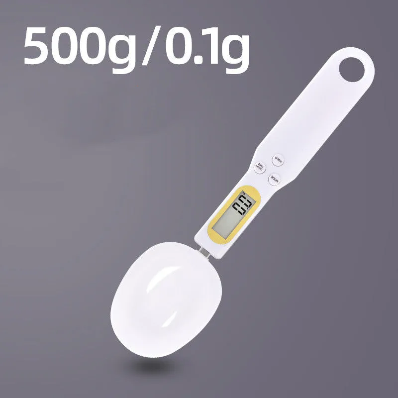 Black digital measuring spoon scale showing 0.0g display on LCD screen with 500g capacity
