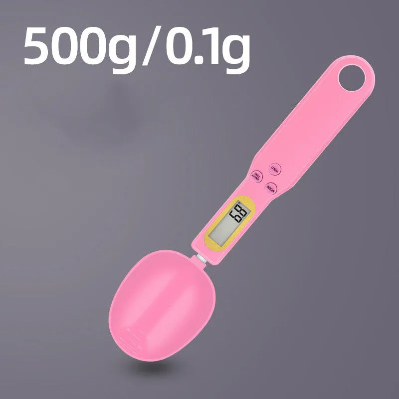 Black digital measuring spoon scale showing 0.0g display on LCD screen with 500g capacity