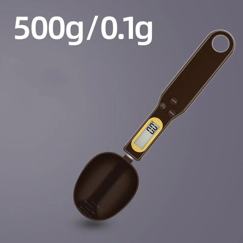 Black digital measuring spoon scale showing 0.0g display on LCD screen with 500g capacity