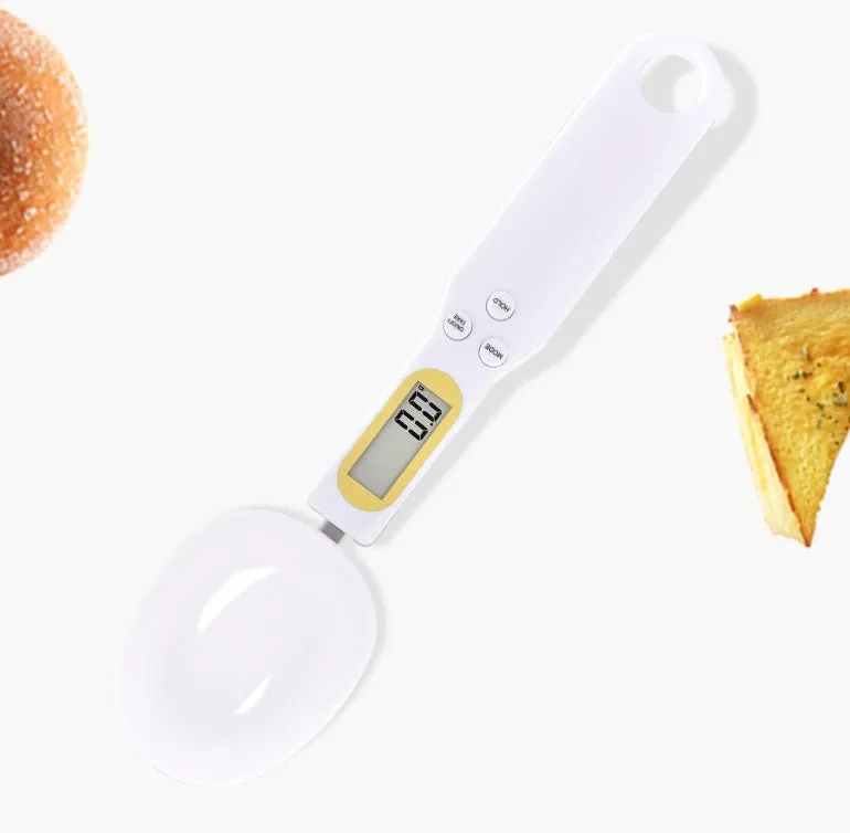 Black digital measuring spoon scale showing 0.0g display on LCD screen with 500g capacity