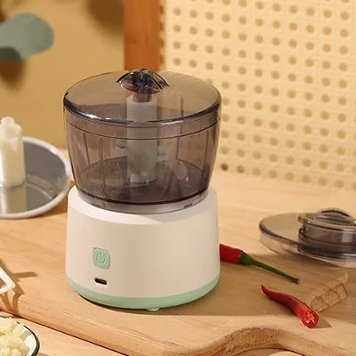 Mini electric meat grinder with transparent 225ml cup and stainless steel blades in light green colour
