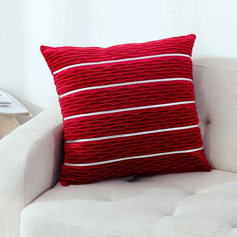 Soft striped velvet pillow cover for a sofa cushion in silver grey colour, shown on a chair.