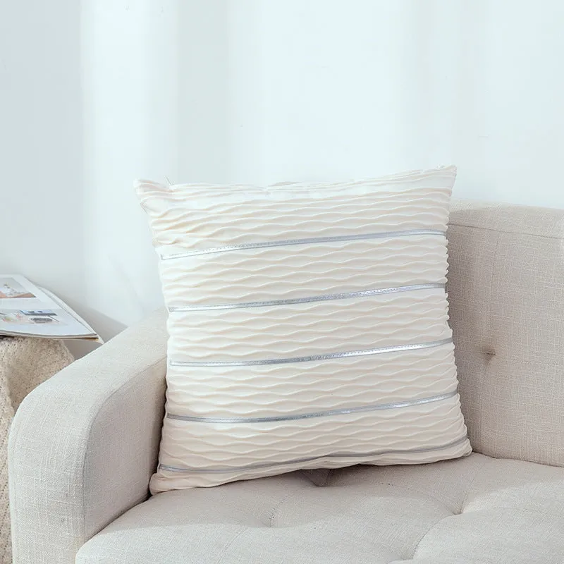 Soft striped velvet pillow cover for a sofa cushion in silver grey colour, shown on a chair.