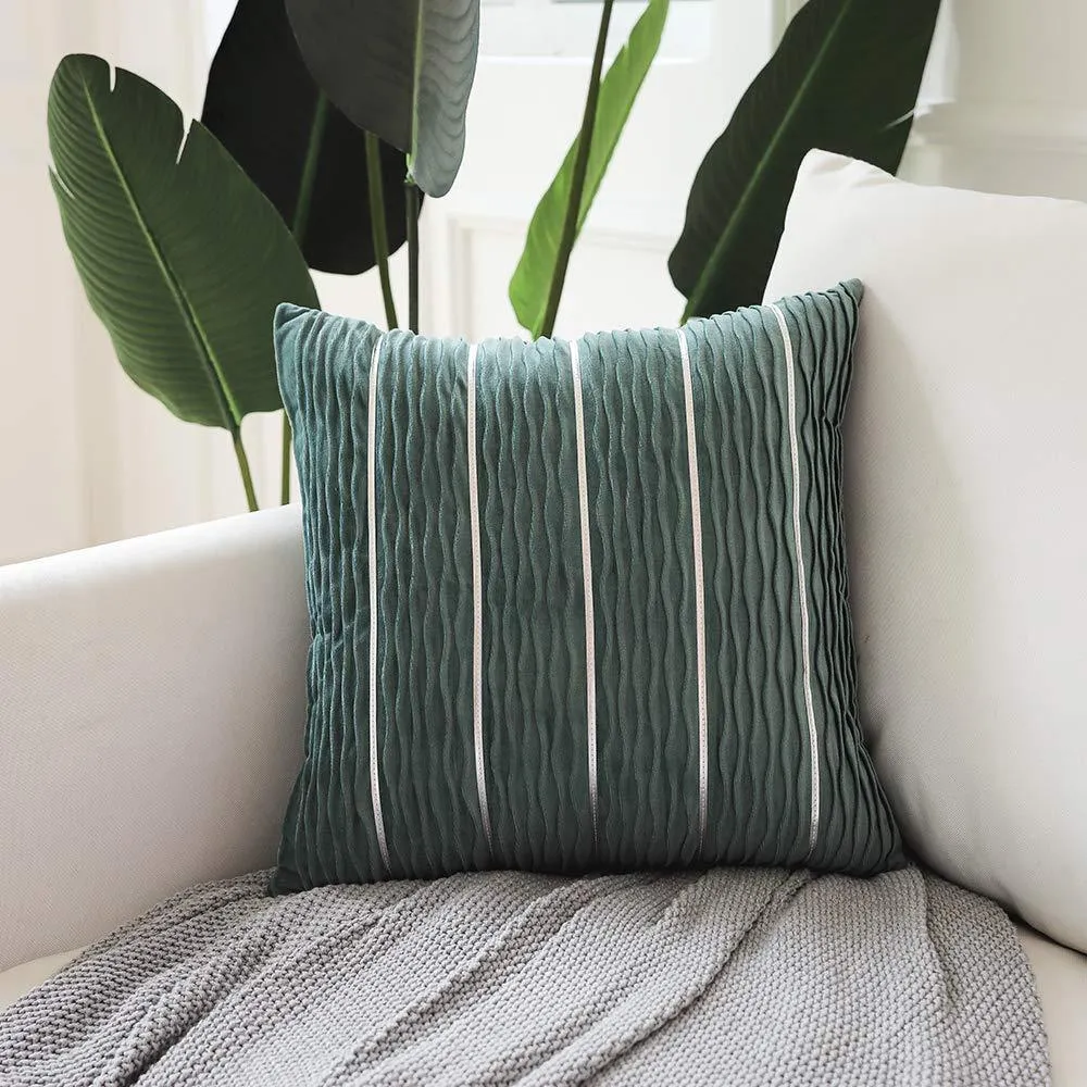 Soft striped velvet pillow cover for a sofa cushion in silver grey colour, shown on a chair.