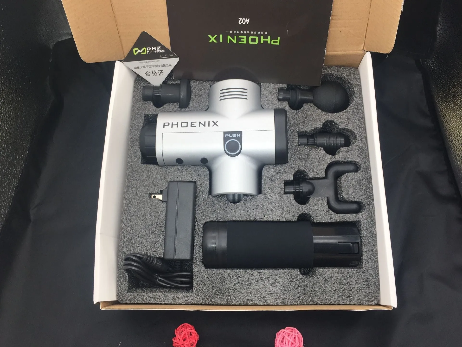 Fascia massage gun with four interchangeable heads in black finish