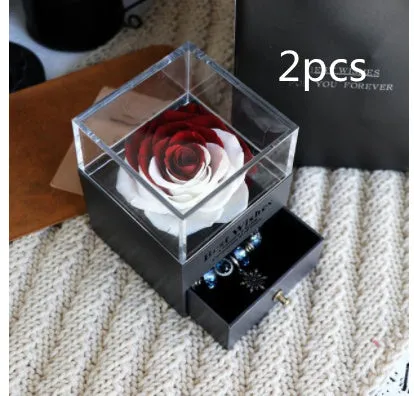 Blue eternal flower gift box with roses and carnations, dimensions 8.5 by 8.5 by 10.5 cm.