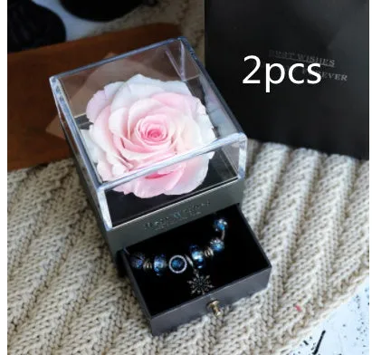Blue eternal flower gift box with roses and carnations, dimensions 8.5 by 8.5 by 10.5 cm.