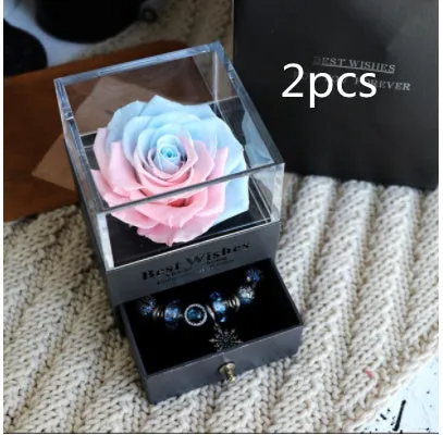 Blue eternal flower gift box with roses and carnations, dimensions 8.5 by 8.5 by 10.5 cm.