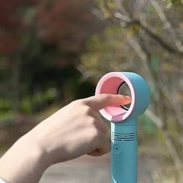 A portable bladeless desk fan with USB charging cable, shown in one of the available colours such as blue, black, or white.