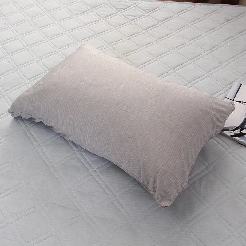 Blue and grey polyester cooling blanket with Japanese Q-Max fibres on a bed.