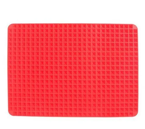 Red silicone pyramid grid cooking mat on a kitchen countertop.