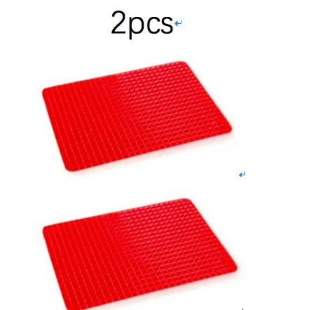 Red silicone pyramid grid cooking mat on a kitchen countertop.