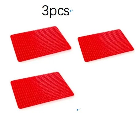 Red silicone pyramid grid cooking mat on a kitchen countertop.