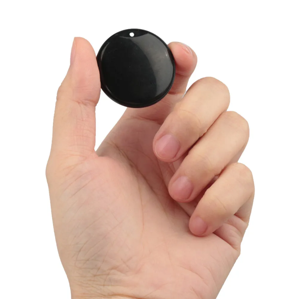 White and black GPS tracker for pets and keys with hanging rope attachment