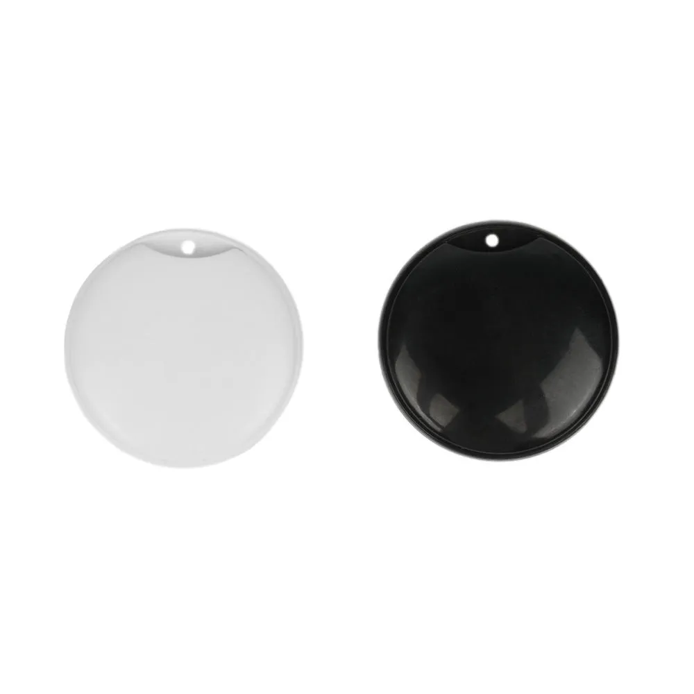 White and black GPS tracker for pets and keys with hanging rope attachment